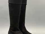 a pair of black boots on a white background