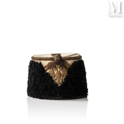 the black and gold clutch bag is adorned with a lion head