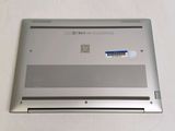a silver laptop with a blue sticker on the back of it