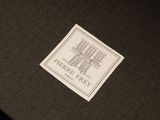the logo or sign for the hotel is shown on a black box