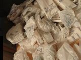 a pile of bags of toilet paper sitting on a table