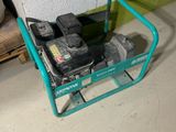 a small green cart with tools on it in a garage