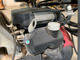 a close up of a motorcycle engine in a garage