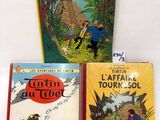 trois livres pour enfants, dont « Tintin et les Picaros » et « Les Aventures de Tintin »