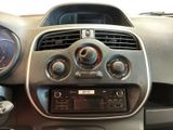 a dashboard of a car with a radio and a steering wheel
