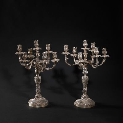 a pair of silver plated candelabs