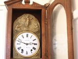 a grandfather clock in the corner of the room
