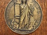 a close up of a medal on a wooden surface