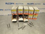four boxes of screws and a couple of screws on a table