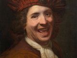 portrait of a laughing man in a red hat