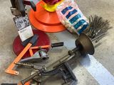 a bunch of tools on the floor next to a fire hydrant
