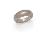a close up of a silver ring on a white background