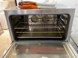 an open oven with a bunch of food inside of it
