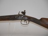 an old gun that is on display in a museum