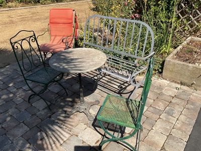 a table and chairs sitting on a brick patio