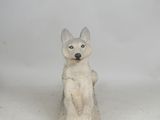 a small statue of a dog sitting on top of a box