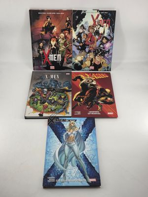 the x - men comic books are lined up on a white surface