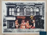a black and white photo of a group of people in front of a building