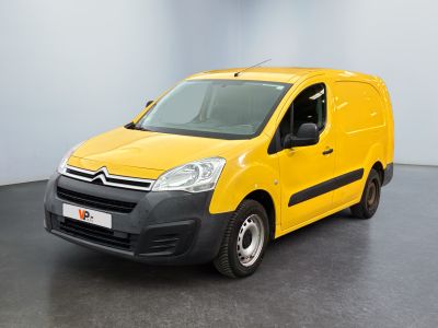 yellow citrole van parked in a white room with a black floor