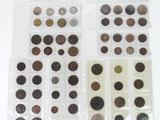 many different types of coins in this display case