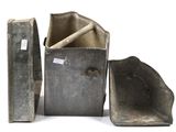 three pieces of metal that are sitting next to each other