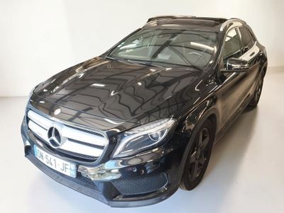 the mercedes gle is parked in a white room