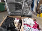 two boxes of clothes sitting on a carton in a warehouse