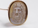 an image of a close up of a ring with a man ' s face on it