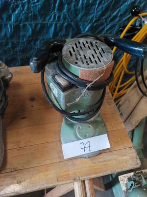 a small machine that is sitting on a wooden table