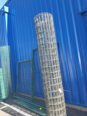 a blue building with a bunch of wire mesh on it
