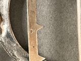 a close up of a metal object with a star on it