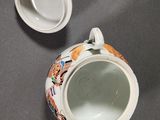 a small cup with a lid sitting on a table