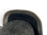 a black hat with a red ribbon around it
