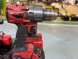 a cordless drill that is sitting on a piece of wood