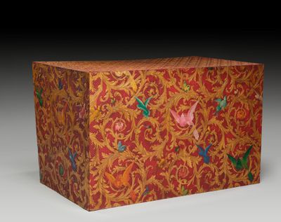 an orange box with a floral design on the front and sides