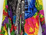 an image of a colorful jacket on a hanger on a white background