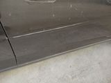 a close up of a car door handle with a sticker on it