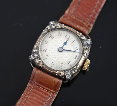 an image of a watch with a brown leather strap on a black surface