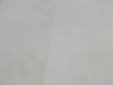 a bed with a white sheet on top of it