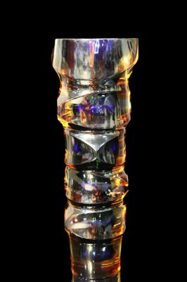 a glass vase that is sitting on a table