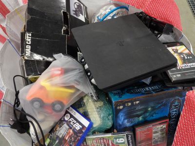 a plastic container filled with video games and other items