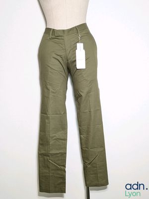 an image of a mannequin mannequin wearing khaki pants and a white shirt