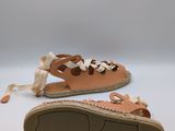 a close up of a pair of sandals on a white surface