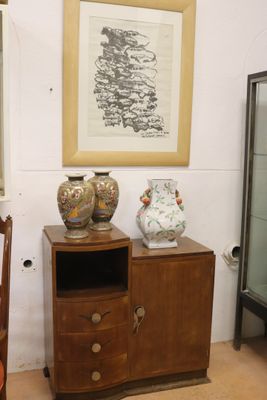 two vases sitting on a table in a room