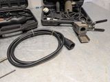 two tools that are sitting on a table