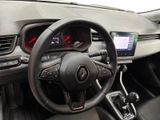 the interior of a car with a steering wheel and dashboard controls