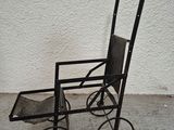 a small metal cart that is sitting on the ground