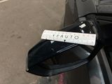 a sticker on the side mirror of a car