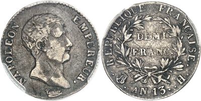 a close up of a coin on a white surface