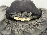 a close up of a hat on a mannequin mannequin